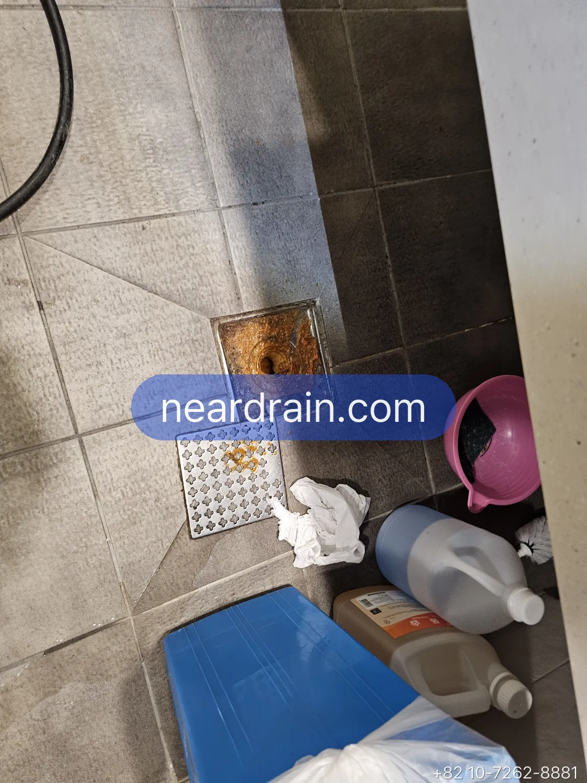 A floor drain before clearing
