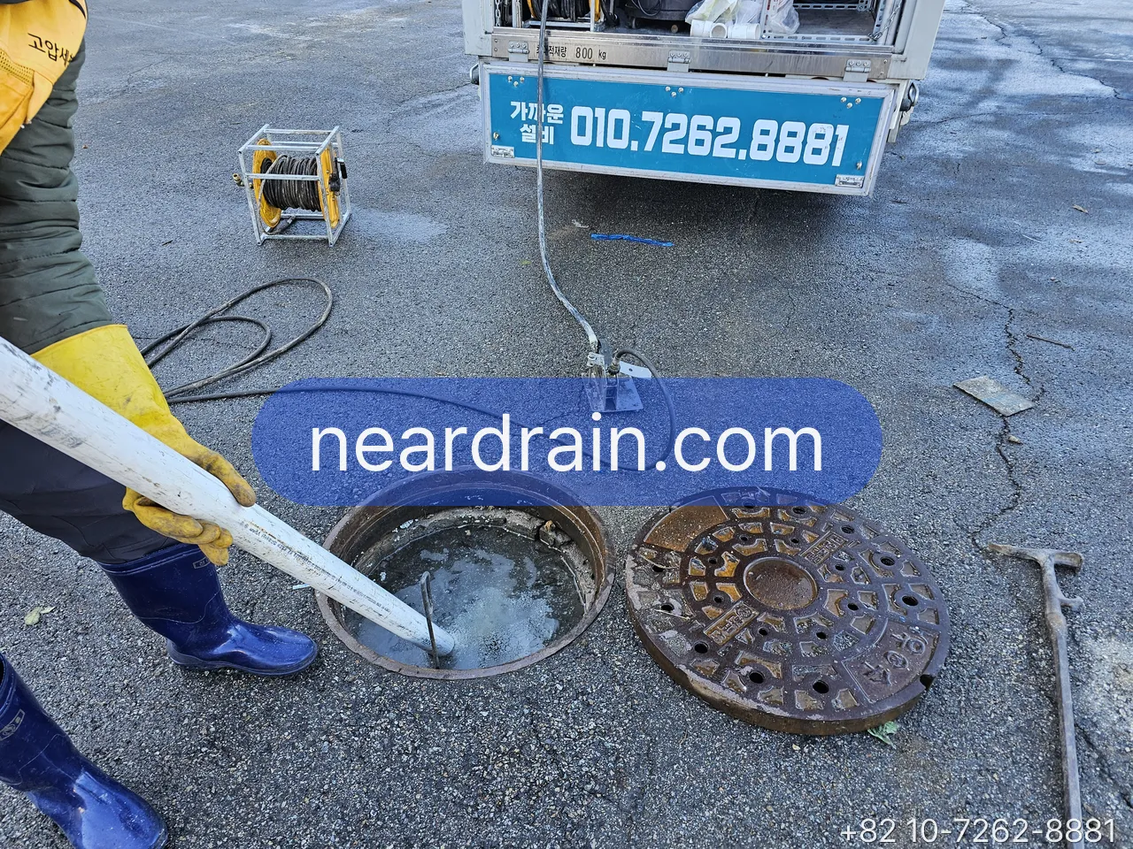 Our crew jetting a manhole sewer line next to the NearDrain truck in Seoul